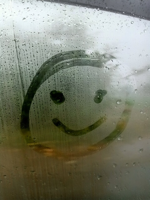 Smile on a humid car window