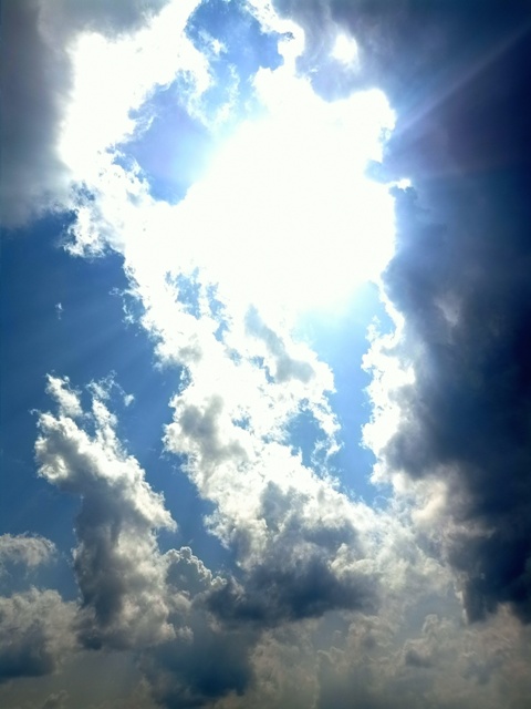 A dark cloud with sunshine