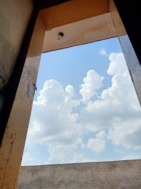Clouds view from an opened door 