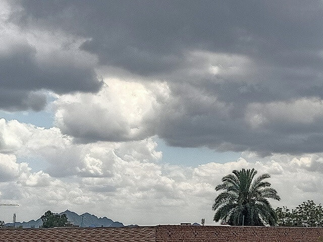 Storm clouds with a mountain view from city 