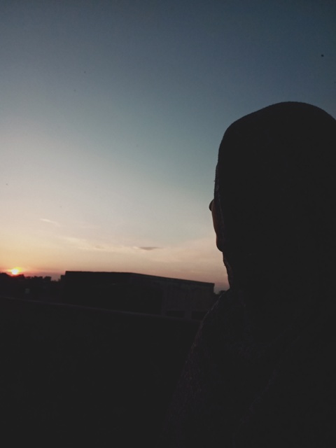A girl watching sunset