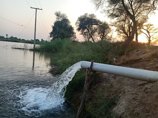 Tube well with sunset