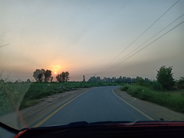 A road to city with sunset