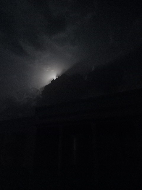 Moonlight beam from dark clouds 