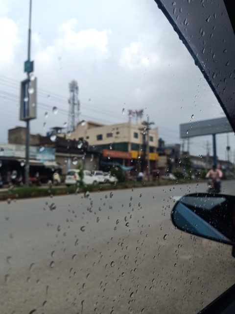 Rainy weather and traveling on a road