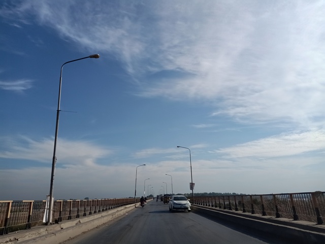 Traveling through bridge with beautiful sky