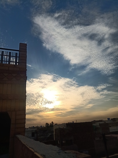 Evening sun with cloud from rooftop