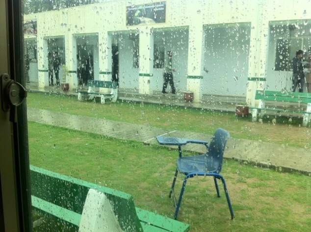 Rainy lawn with a chair