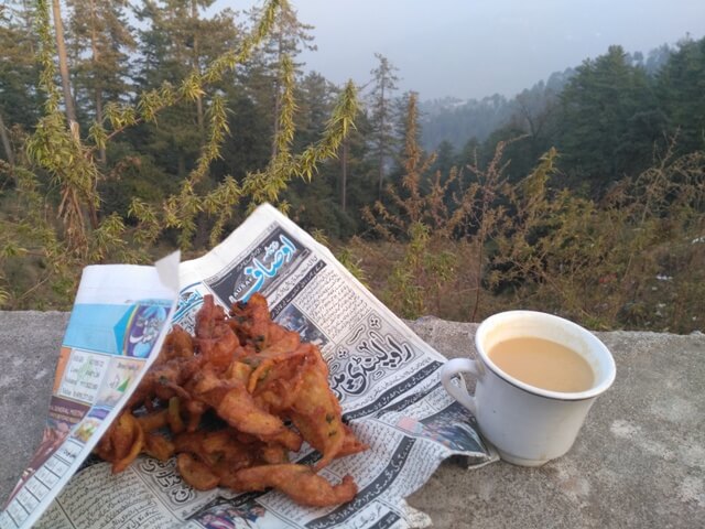 Fritters and tea with mountain view