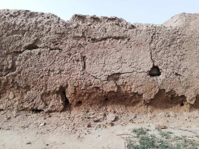 Mud house wall with cracks