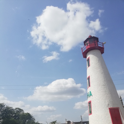 Lighthouse with sky and clouds