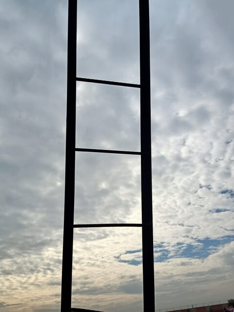 Cloudy sky with ladder