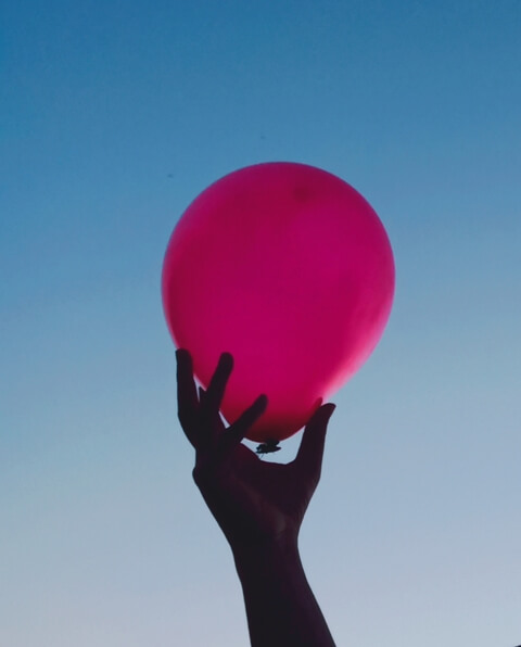 Balloon in the hand with sky background