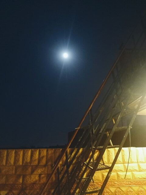 Full moon from a terrace with ladder