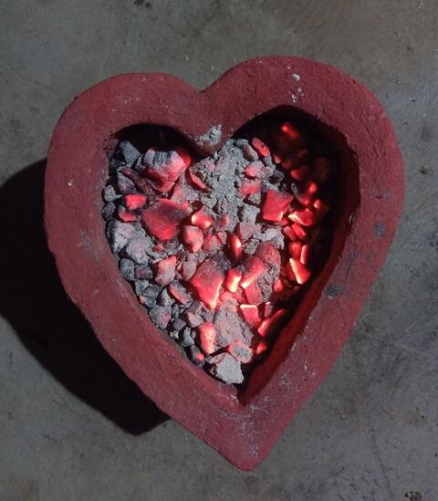 Heart shaped mud pot for fire