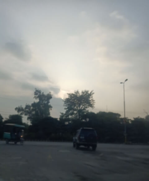 A cloudy evening in a city road