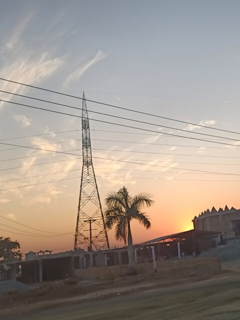 Sunset with electric poles