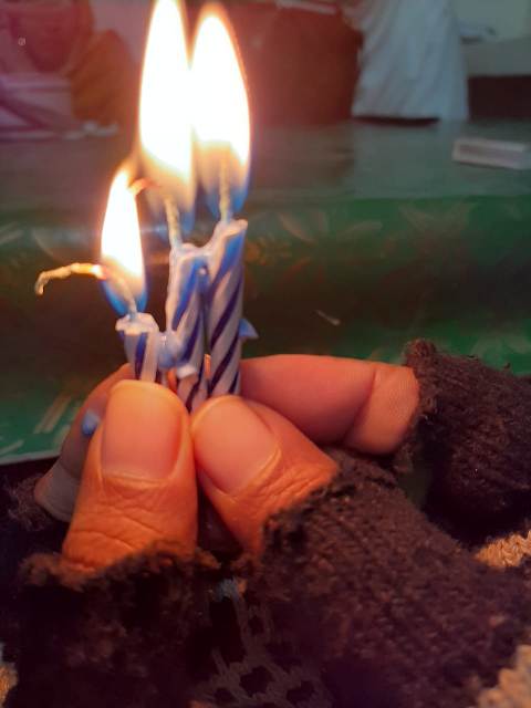 Candle lights in a hand