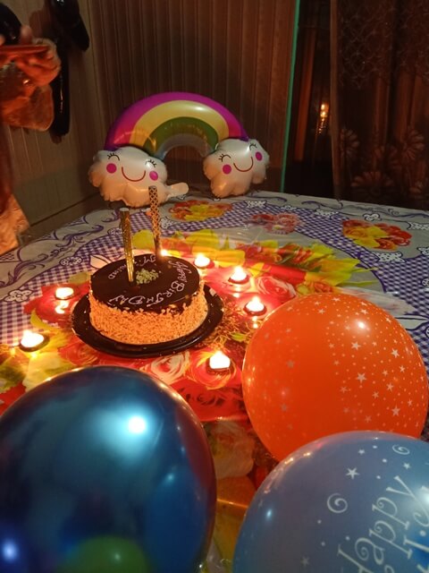 Cake and balloons for a baby's birthday