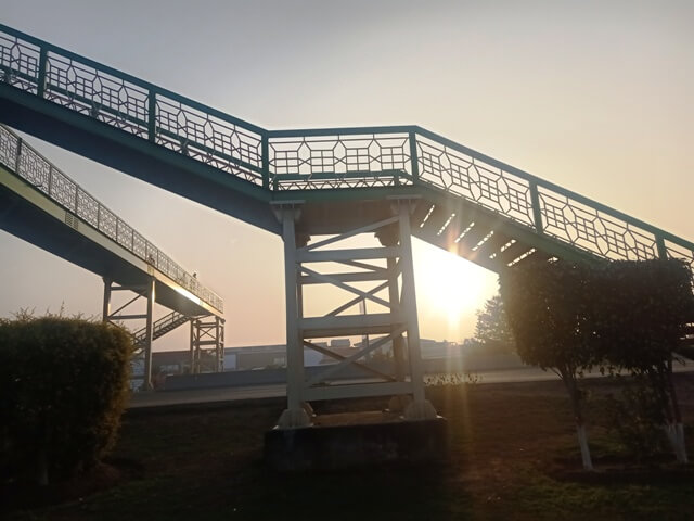 Sun beams through a bridge 