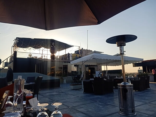 Sunny day on a rooftop cafe 