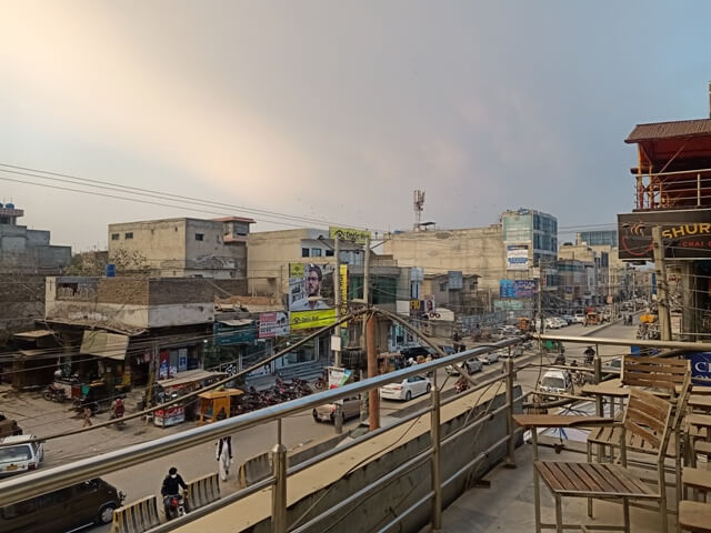 A city road with buildings during cloudy weather 