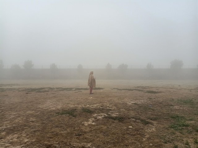 A girl in a foggy morning 