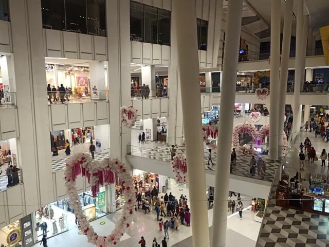 A shopping mall with valentines day decor 