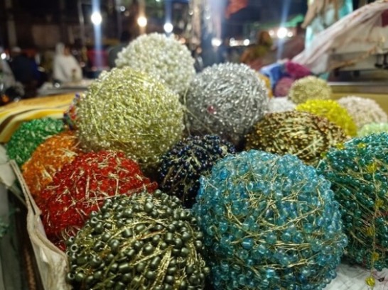 Attractive balls of bead strings 